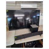 Flatscreen tv and sound system. 4-2
