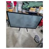 50in Samsung flatscreen on stand w/remote. 13-19