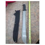 Sawback machete with sheath. 13-33