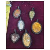 polished semi-precious stone amulets. 25-8