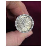 Unsearched 25 dollar roll of U.S. dollars. 5-29