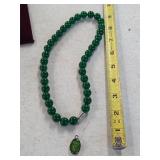 Jade necklace and opal pendant. 80-8