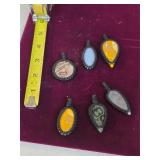 Polished semi-precious stone amulets. 25-7