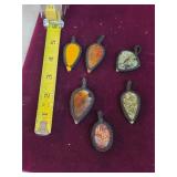 Polished semi-precious gemstone pendants. 25-9