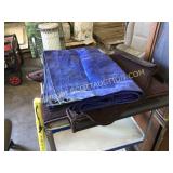 Small blue plastic tarp, and brown Dodge Ram