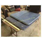 Two blue folding card tables