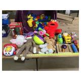 Tote of plush animal, toys, toy cars and trucks,