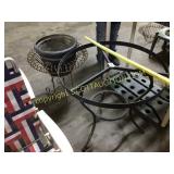 Wire planter pot holder with pot and patio table