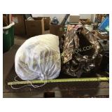 Large comforter in mesh bag with camo barrel bag