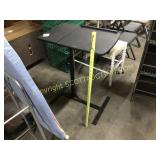 Black adjustable height, bed tray