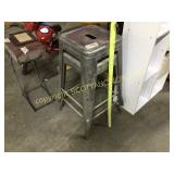 Two metal stackable shop stools