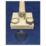 Lot of 4 silvertone rings, various sizes
