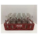 Coca-Cola crate of old glass milk bottles