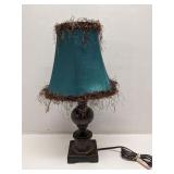 Bronze colored lamp with teal shade