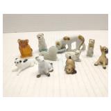 Group of small animal figures, mostly dogs