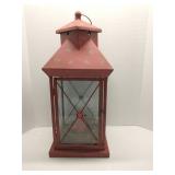Decorative red metal and glass candle lantern
