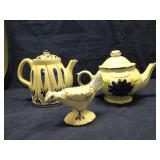 Two blue/white teapots and a chicken egg cup