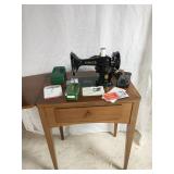 Singer model 99 sewing machine and cabinet