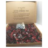 Box full of plastic letters