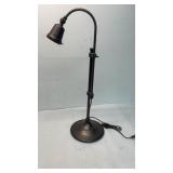 bronze-tone pharmacy-style table lamp with an