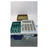 Flatware organizers with assorted scissors.