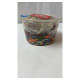 Small bucket of craft stuff strands of beads,