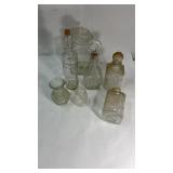4 Decanters, a vase, a glass Jar