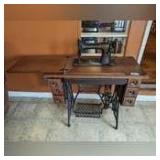 ANTIQUE SINGER SEWING TABLE WITH BUILT-IN PEDAL DRIVEN MACHINE