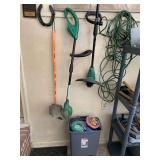 2 WEEDEATERS, TRASHCAN FULL OF NEW WEEDEATER LINE, HEADS, HORSESHOE, GRAVEL, SQUARE YARDSTICK & HEAVY DUTY EXTENSION CORD - GARAGE