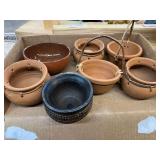 Small terra-cotta pottery bowls, and more, eight pieces total. Two of the small pots are chipped on the rims, see pictures for details.