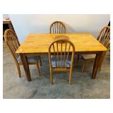 Country style dining table with four arched back chairs, tabletop has a butcher block look, see pictures for details.