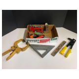 Assorted hand tools to include a speed square, torpedo level, stapler, quick grip, and more. See pictures for details.