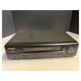 Sharp VHS player, powers up, see pictures for details.