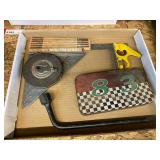 Small assortment of hand tools to include an Allen wrench set, speed square, 100 ft. tape, combination square, and more. See pictures for details.