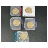 2001, 2002, and 2003 Sacajawea dollars, also includes a 1979 Susan B Anthony dollar, five pieces total, uncirculated, and from mint sets. See pictures or details.