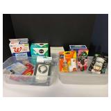 Assorted household items to include portable aromatherapy diffuser, Glade plug-in, Air Wick plug-in, powdered vinyl gloves, and more. Tubs are not included, see pictures for details.