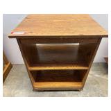 Rolling TV stand, see pictures for details.