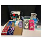 Assorted toiletries to include shampoo, Olay moisturizer, ladies razors, toothpaste, mouthwash, and more. Tub is not included, see pictures for details. ￼￼