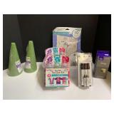 Assorted crafting supplies to include foam cones, tie-dye kits, decorative nail head trim, and more. Tubs are not included, see pictures for details.