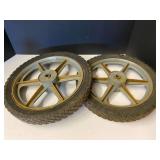 Wheels with rims, believed to be for a mower or yard cart, see pictures for details.