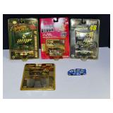 Five diecast race car replicas, four are still in original packaging, tub is not included, see pictures for details.