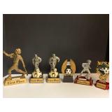 Small first place trophies for soccer, and one for baseball, see pictures for details.