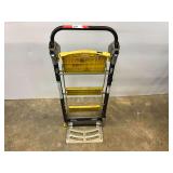 Total Trolley, this piece can be used as a stepladder, handtruck, or rolling cart, see pictures for details.
