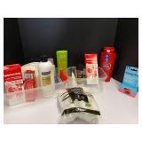 Shelf lot of assorted toiletries marked 6114 to include shampoo, conditioner, total body deodorant, body wash, and more. Tubs are not included, see pictures for details.