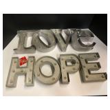 Shelf lot marked 6110 to include two holiday marquees, hope and love, see pictures for details. ￼