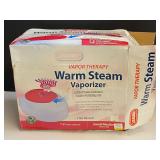 Warm steam vaporizer, comes with the original box, see pictures for details.