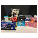 Assorted toiletries to include body sugar scrub, toothpaste, men’s shower gel and fragrance set, make up removers, and much more. Tub is not included, see pictures for details.