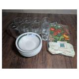 STONEWARE BOWLS, ICED TEA GLASSES, AND ASHLEY TAYLOR CHRISTMAS FLANNEL BACKED VINYL TABLECLOTH IN ORIGINAL PACKAGE