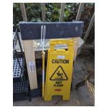 CAUTION WET FLOOR SIGN, FURNITURE DOLLY, AND DUSTER HANDLE