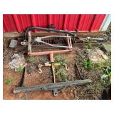 Set of two metal loading ramps, chain binder, and three various type trailer hitches